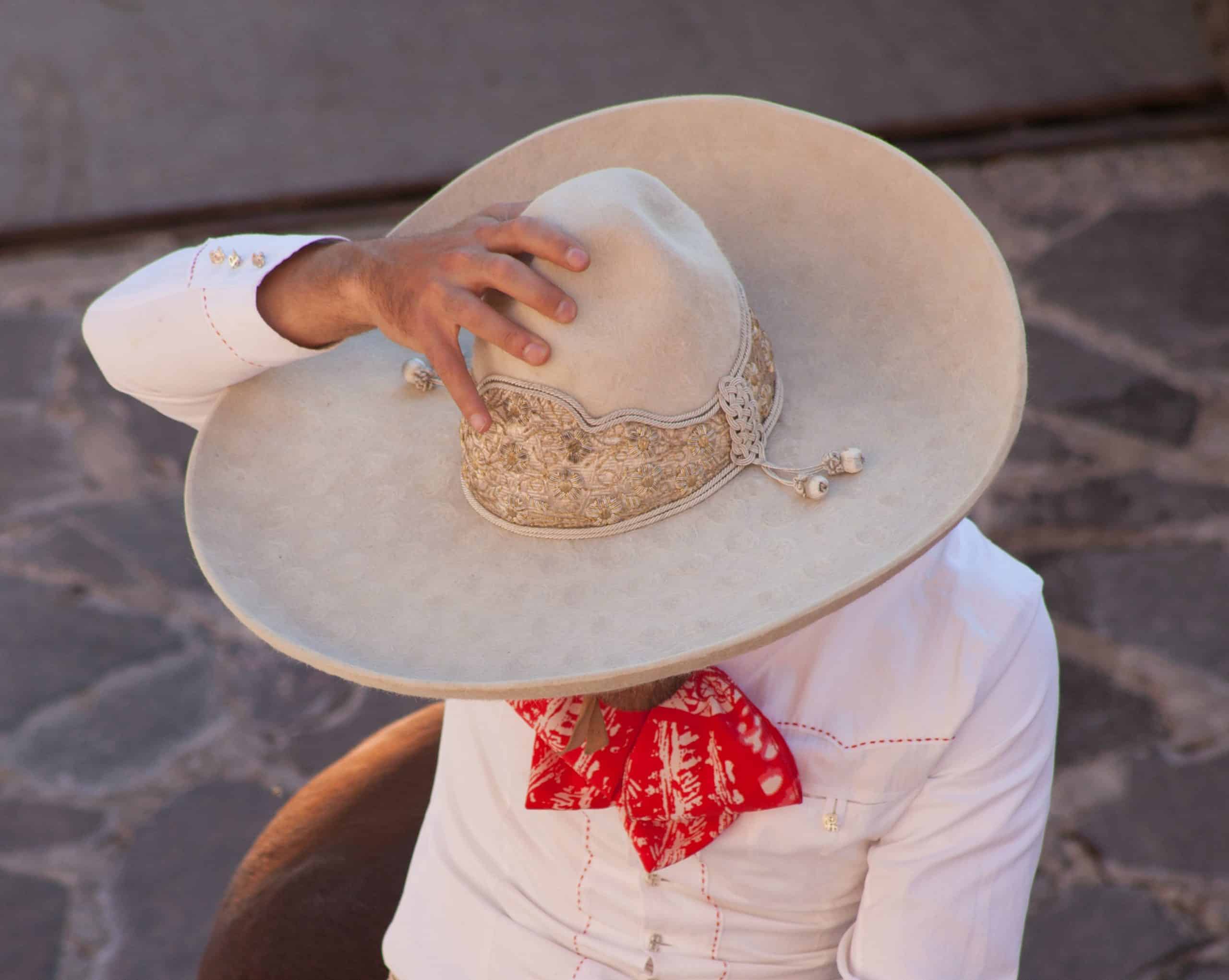 Elegant traditional Mexican hat with intricate embroidery and tassel details.