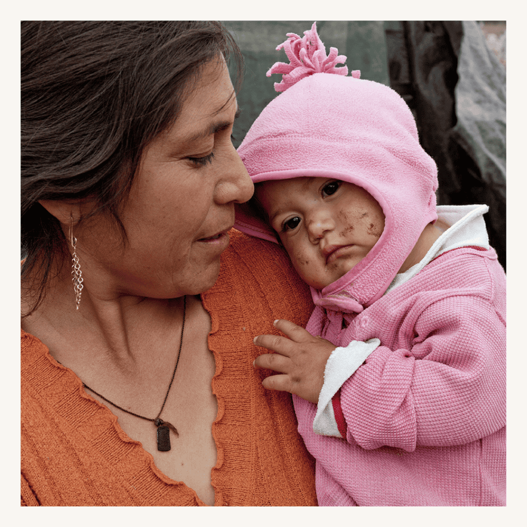 Mother and young girl with a pink hat and jacket, showing compassion and support, featuring a SMCF Nonprofit Network Member organization.