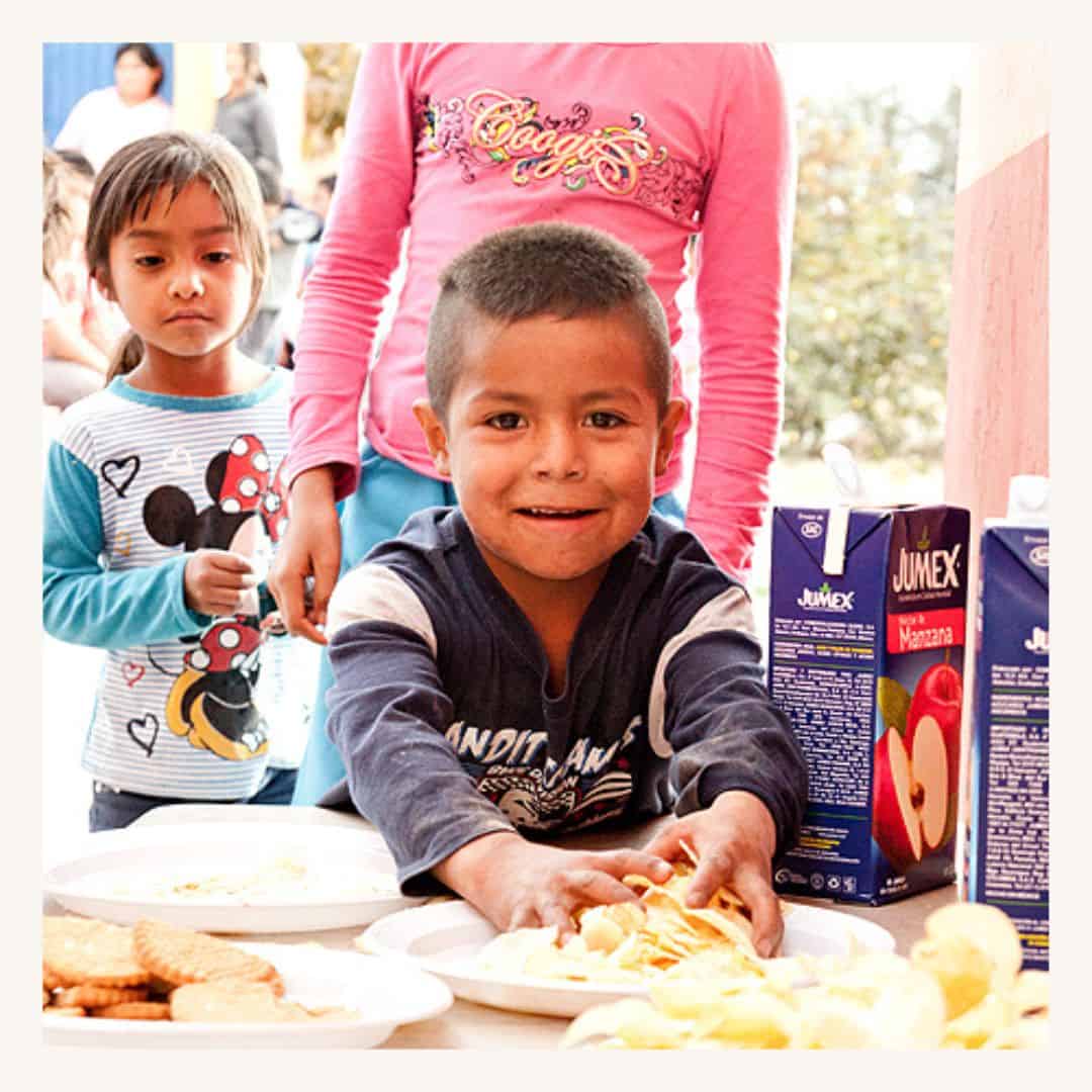 Food donation at a SMCF Nonprofit Network Member event, children enjoying snacks and drinks.