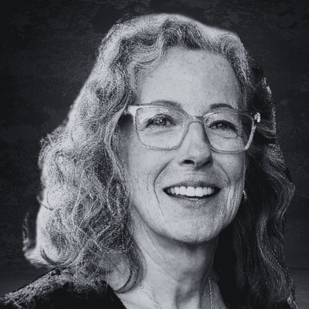 Empowered woman smiling confidently, representing leadership and strength.